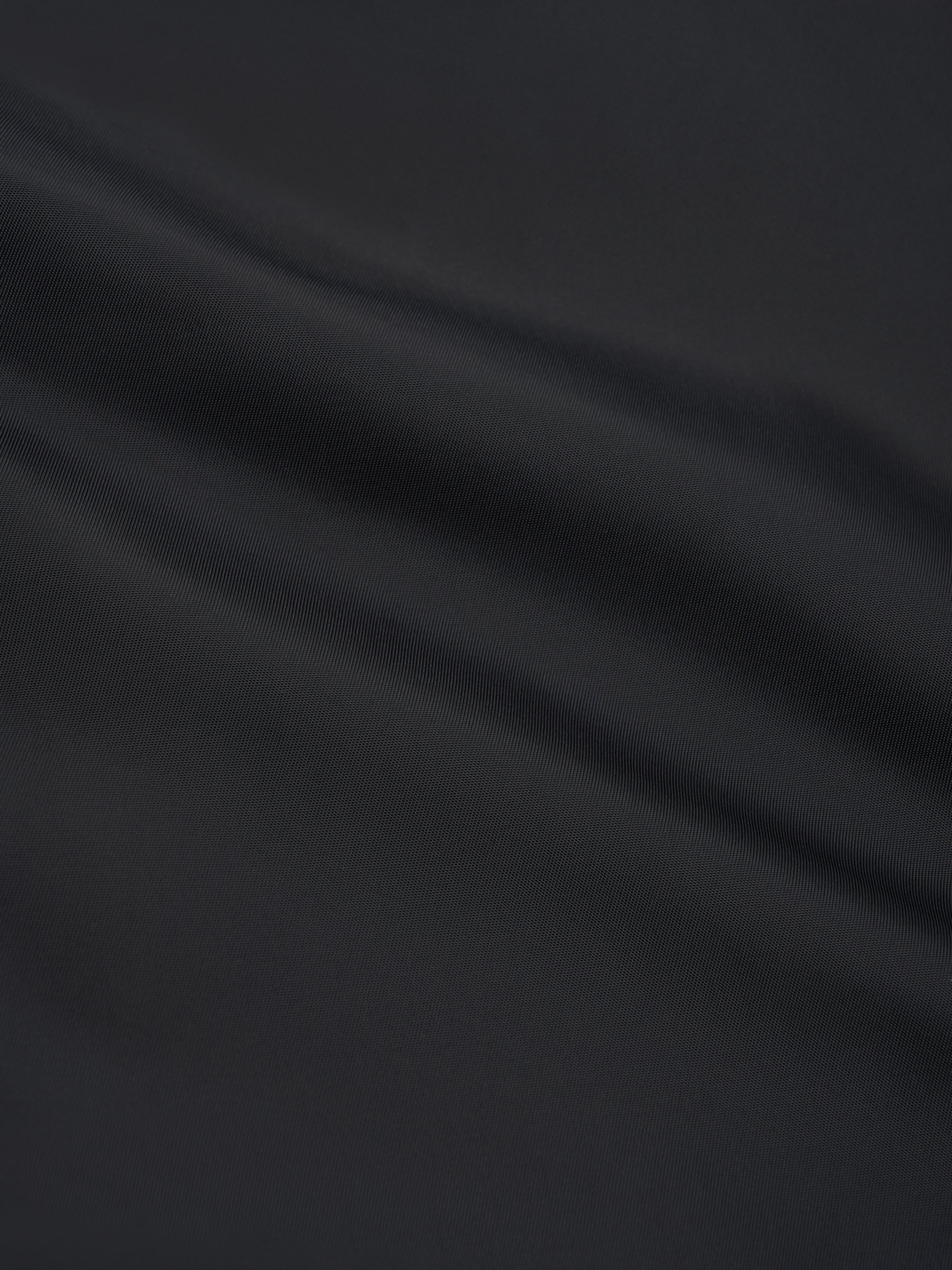 Detailed material shot of Oliver Spencer Men&#39;s Water Repellent Black Bomber Jacket