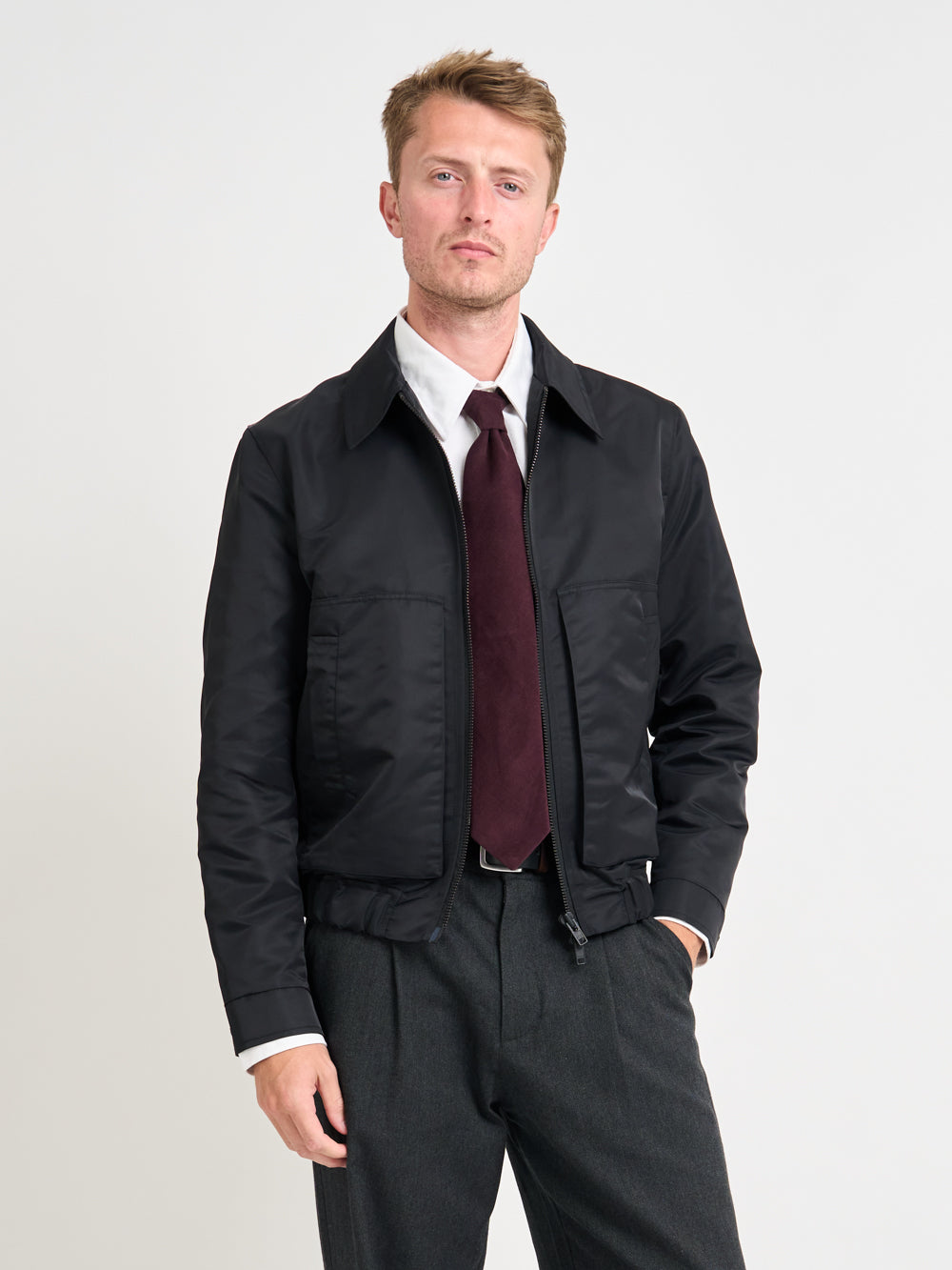 Close up shot of model wearing Oliver Spencer Men&#39;s Water Repellent Black Bomber Jacket