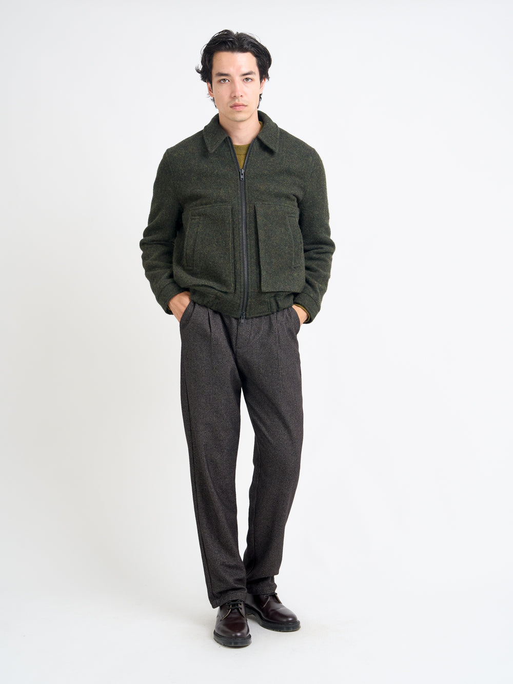 Model wearing Oliver Spencer Men's Green Wool Bomber Jacket Flat Shot