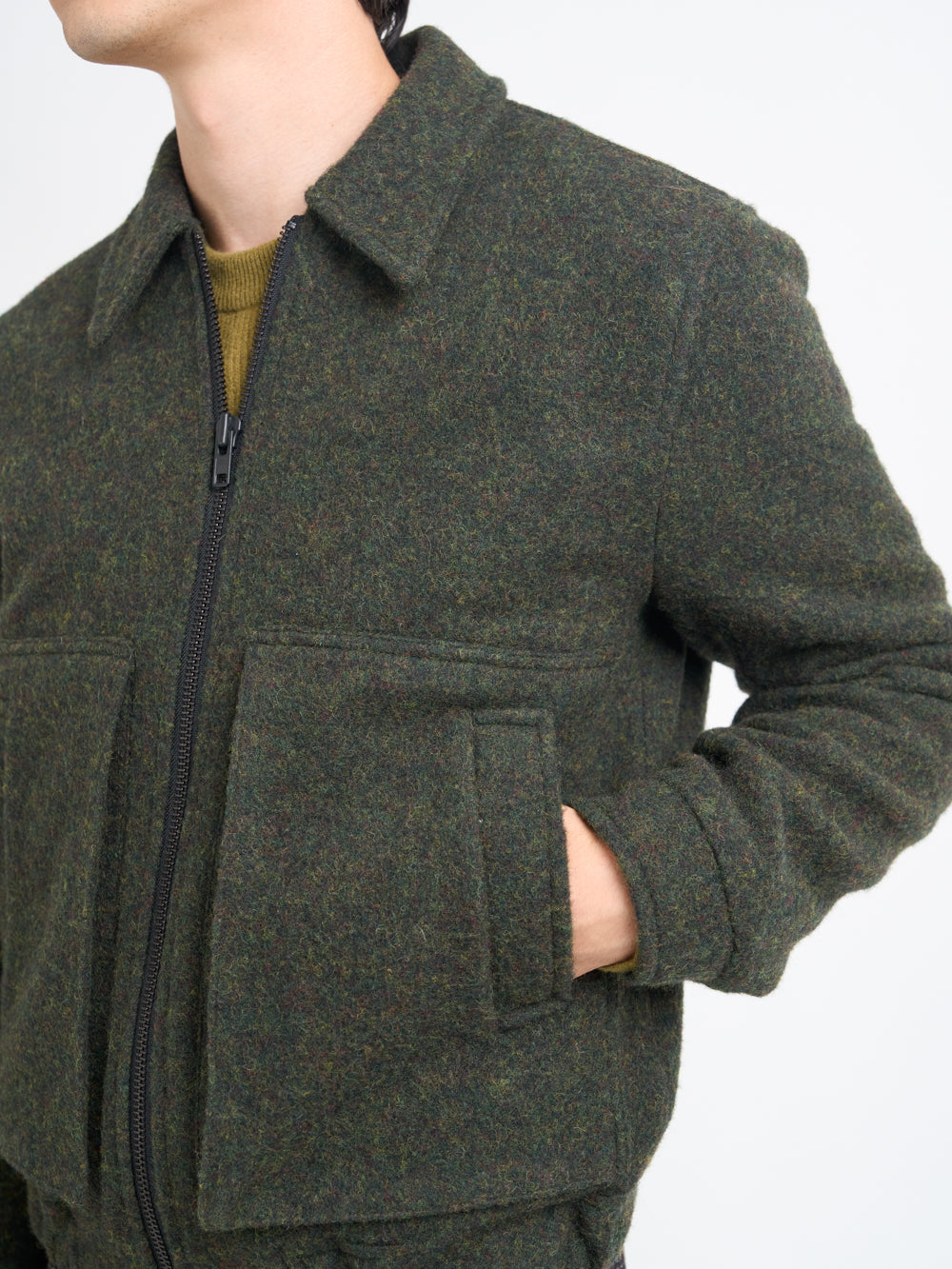Detailed shot of model wearing Oliver Spencer Men's Green Wool Bomber Jacket