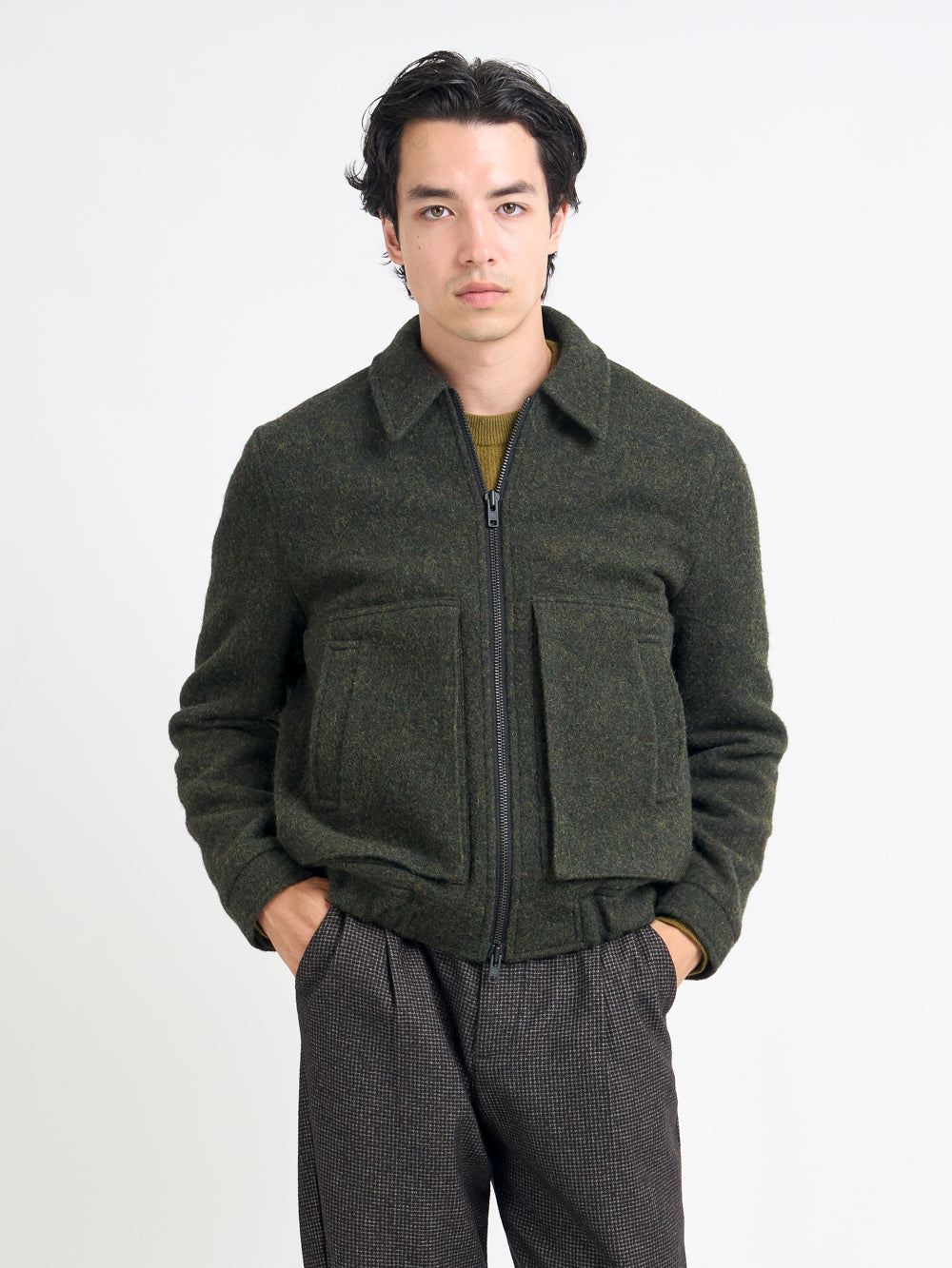 Detailed shot of model wearing Oliver Spencer Men's Green Wool Bomber Jacket