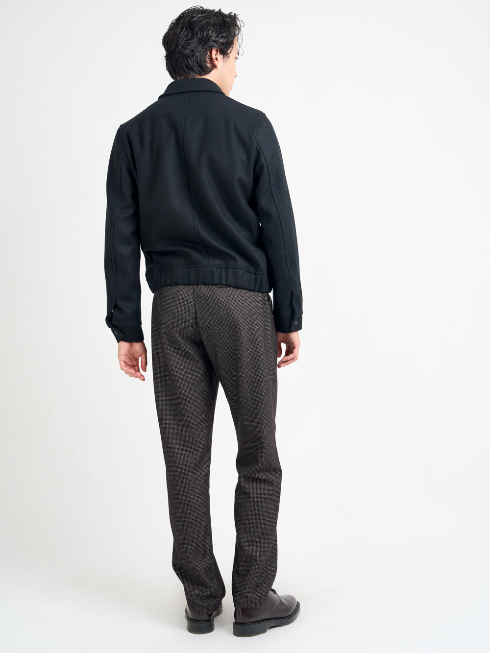 Back shot of model wearing Oliver Spencer Men's Black Wool Bomber Jacket