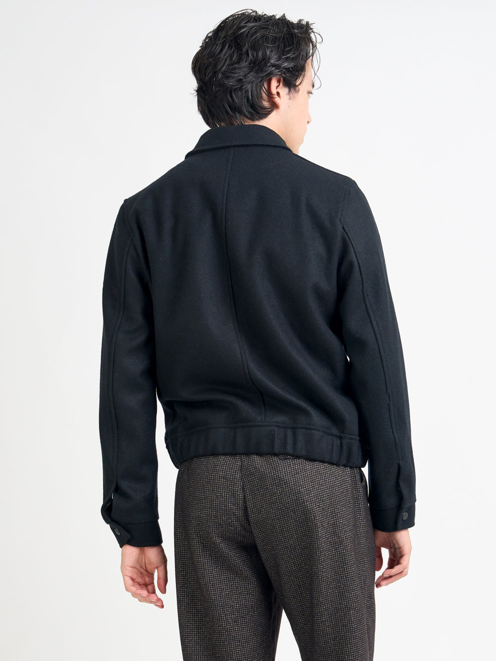 Close up back shot of model wearing Oliver Spencer Men's Black Wool Bomber Jacket