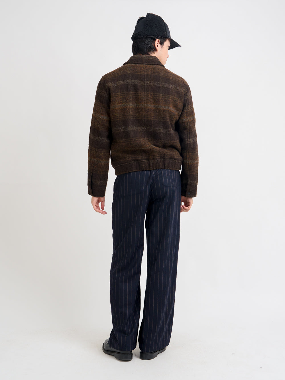 Back shot of model wearing Oliver Spencer Men's Brown Check Wool Bomber Jacket