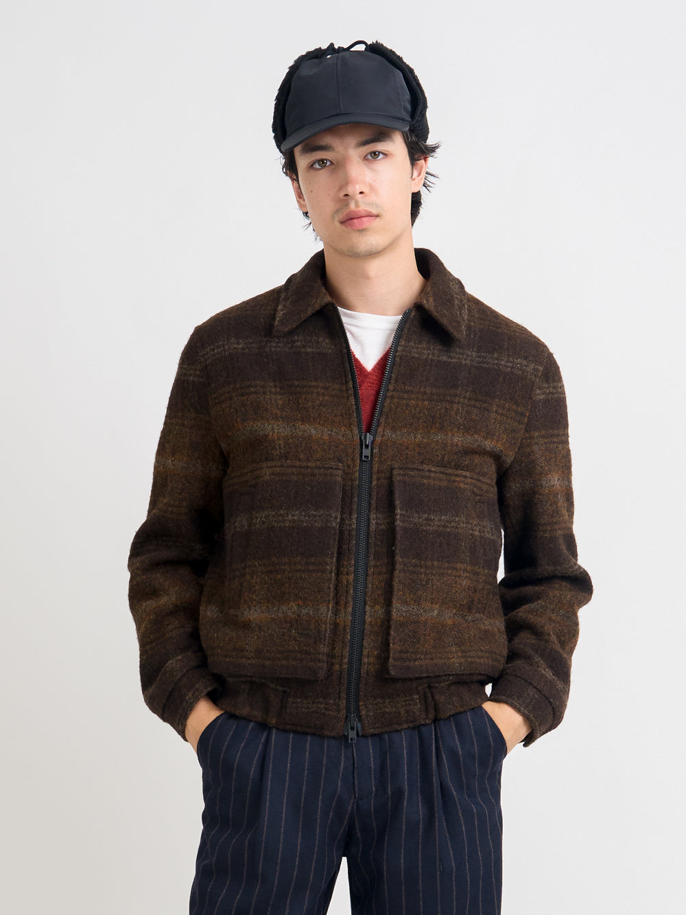 Detailed shot of model wearing Oliver Spencer Men's Brown Check Wool Bomber Jacket