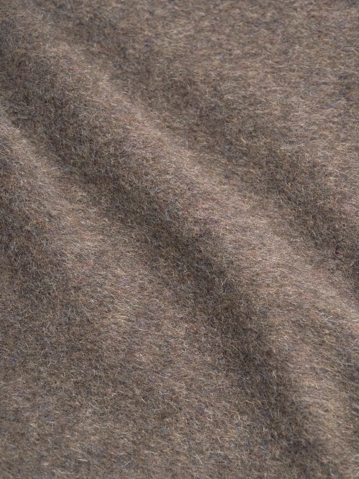 Detailed material shot of model wearing Oliver Spencer Men's Taupe Double-Breasted Wool Trench Coat.