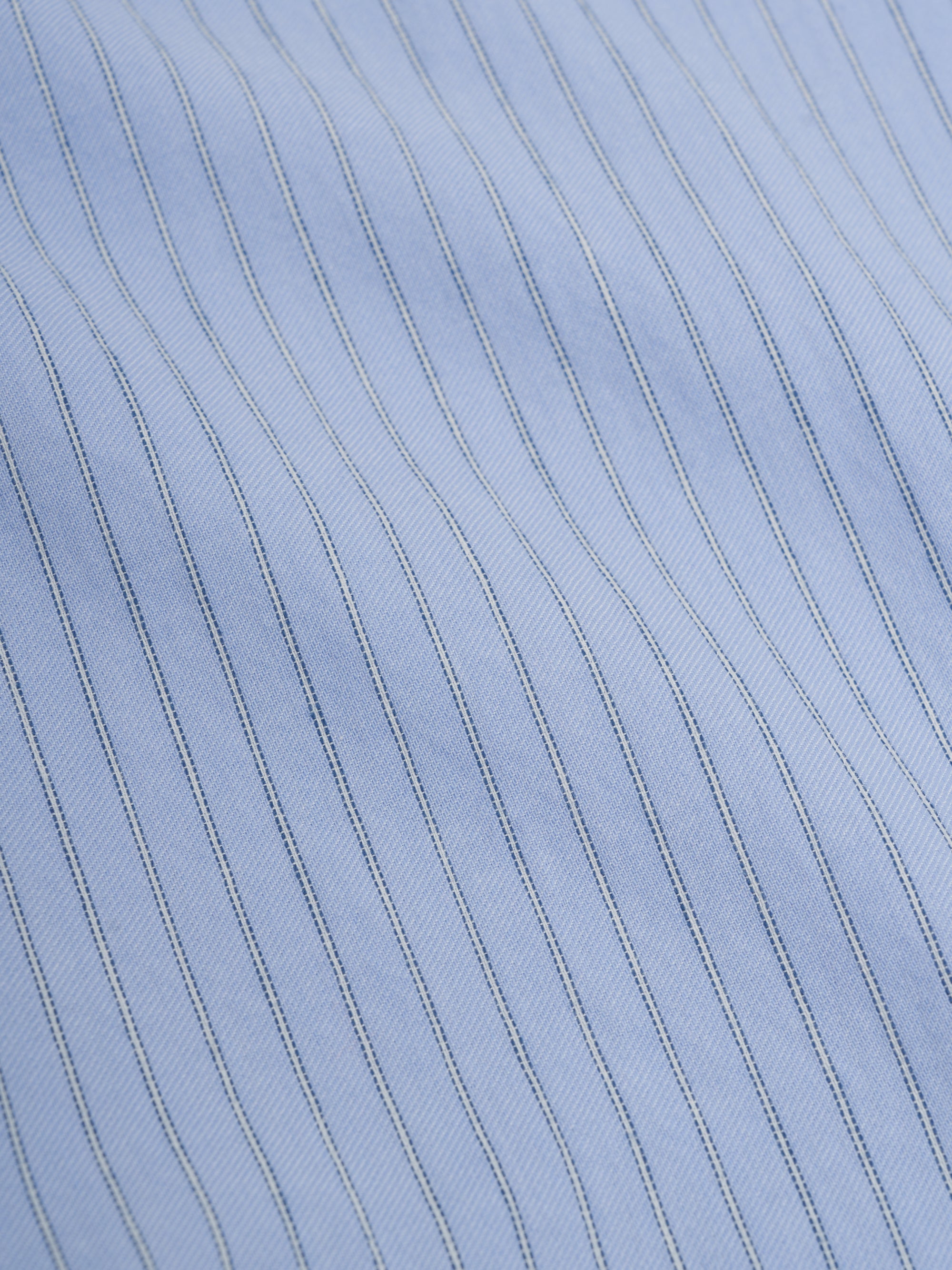 Close up material shot of Oliver Spencer Men&#39;s Pale Blue Pinstripe Organic Cotton Button-Down Shirt