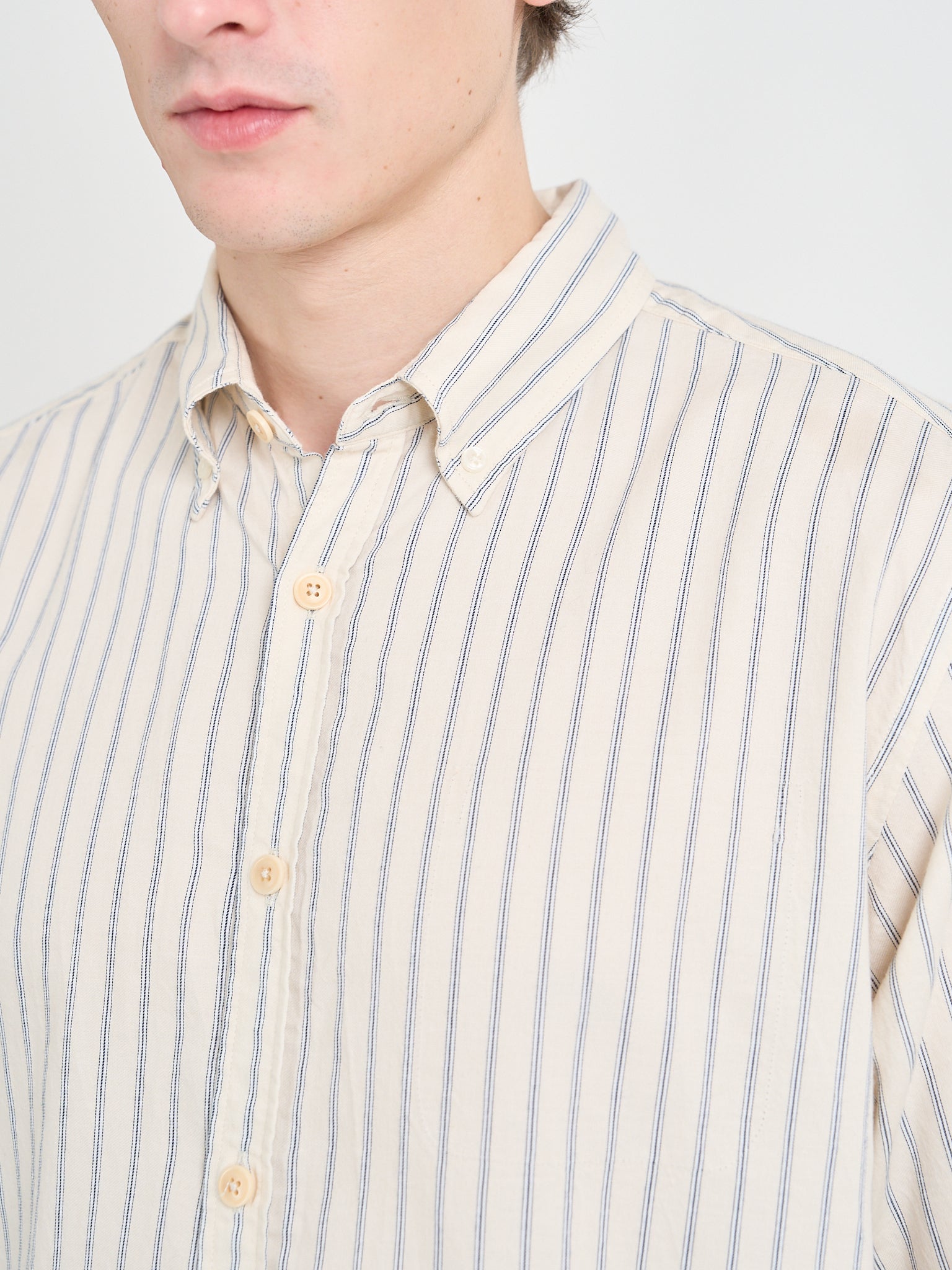 Close up collar shot of Model wearing Oliver Spencer Cream Striped Shirt