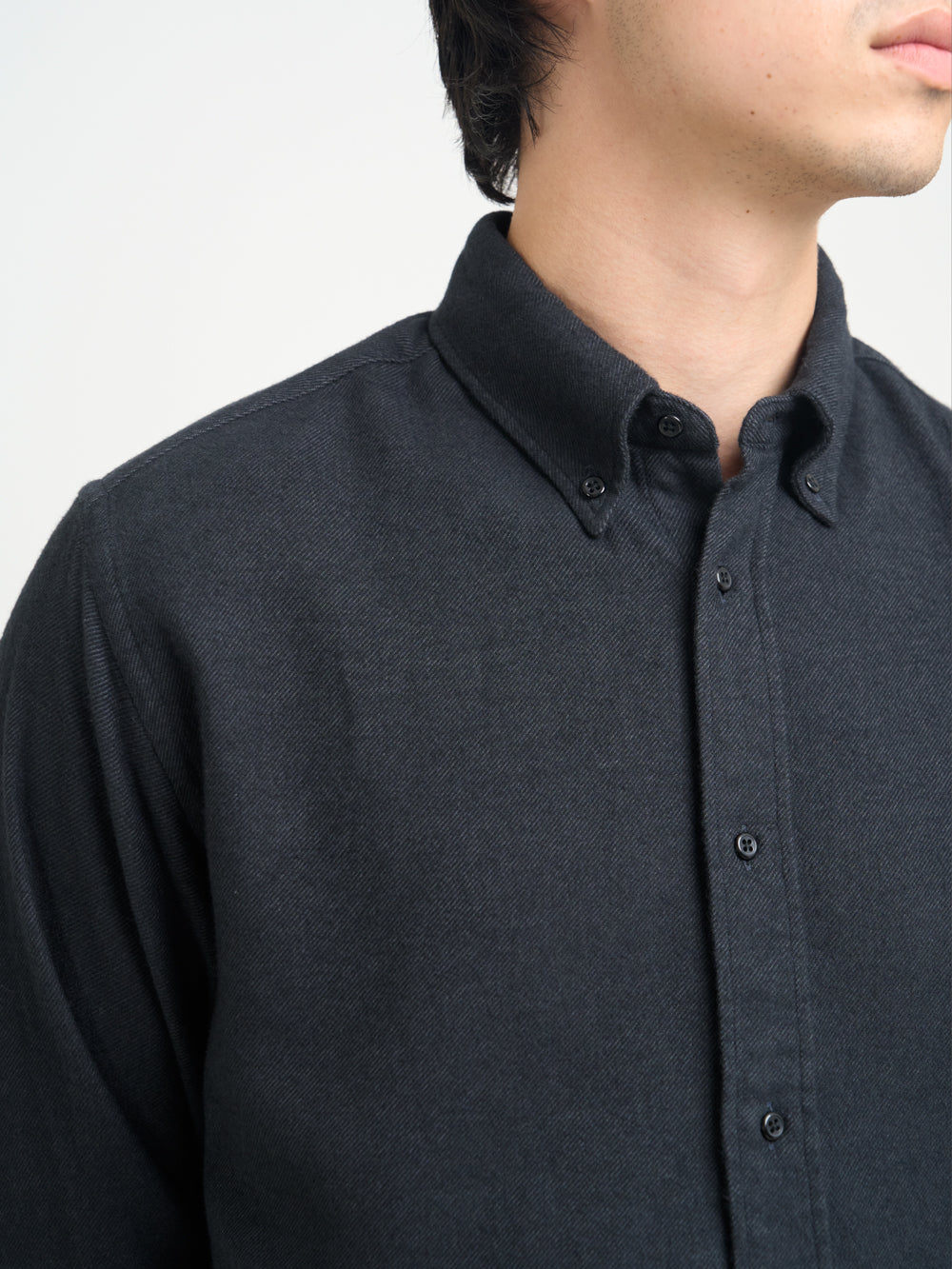 Detailed collar shot of model wearing Oliver Spencer Men&#39;s Dark Grey Button Down Organic Cotton Shirt