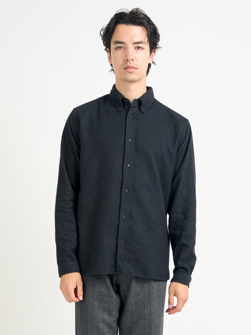 Close up shot of model wearing Oliver Spencer Men&#39;s Dark Grey Button Down Organic Cotton Shirt