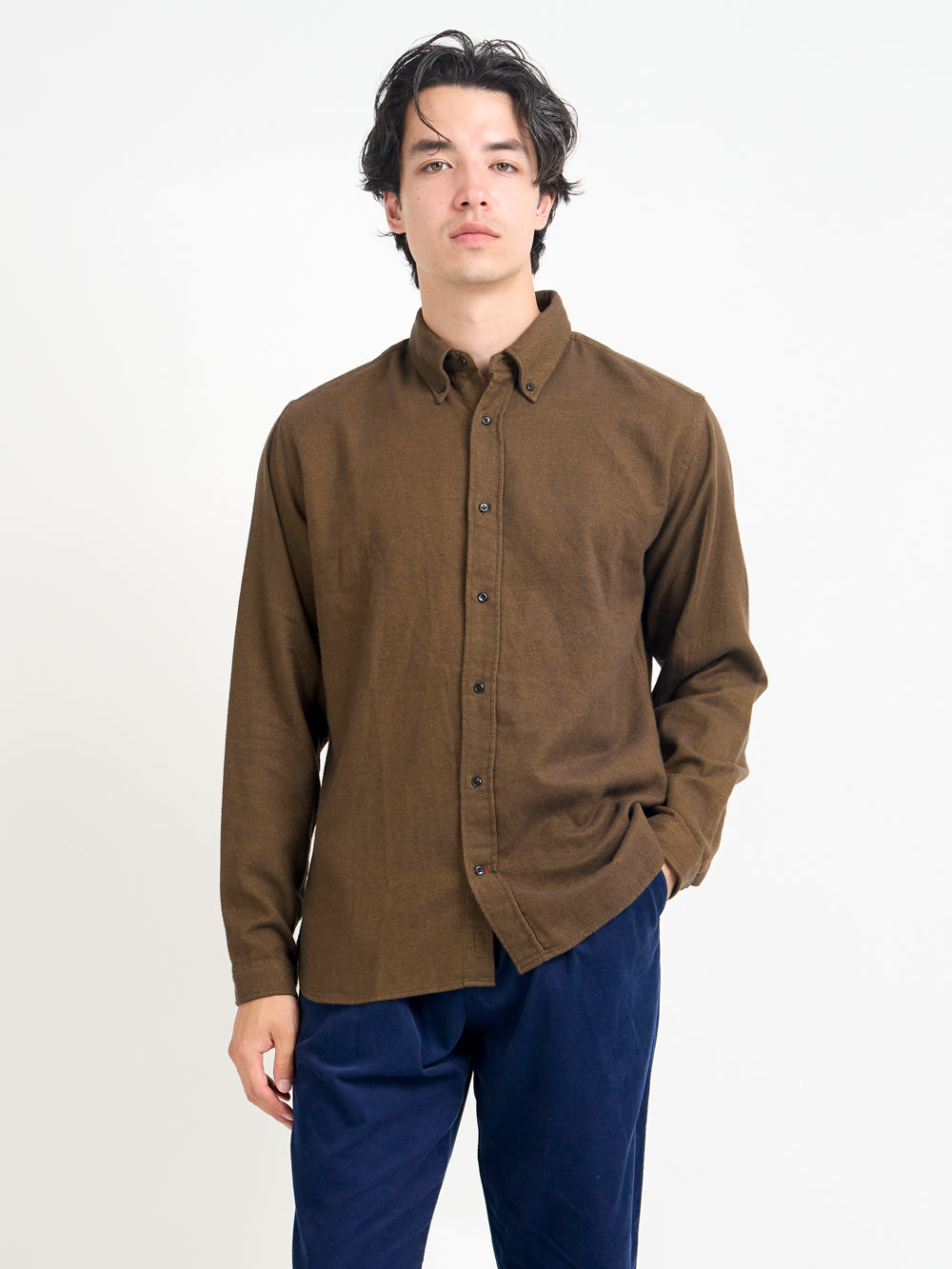 Close up shot of model wearing Oliver Spencer Men&#39;s Brown Button Down Organic Cotton Shirt