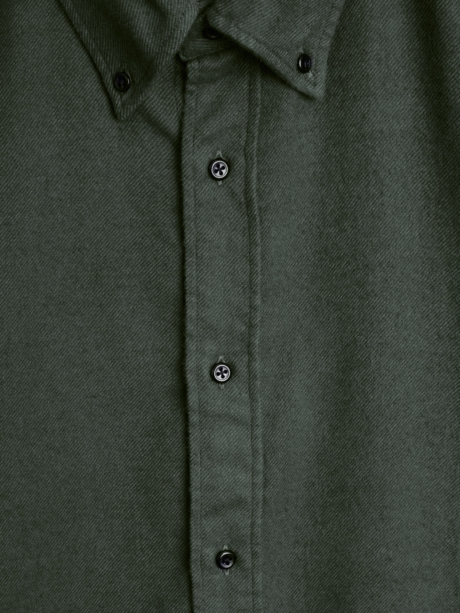 Close up button shot of Oliver Spencer Men's Green Button Down Organic Cotton Shirt.