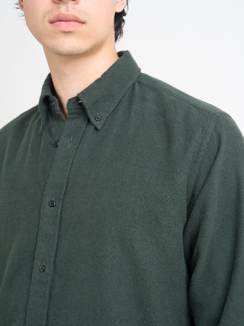 Close up collar shot of model wearing Oliver Spencer Men&#39;s Green Button Down Organic Cotton Shirt.