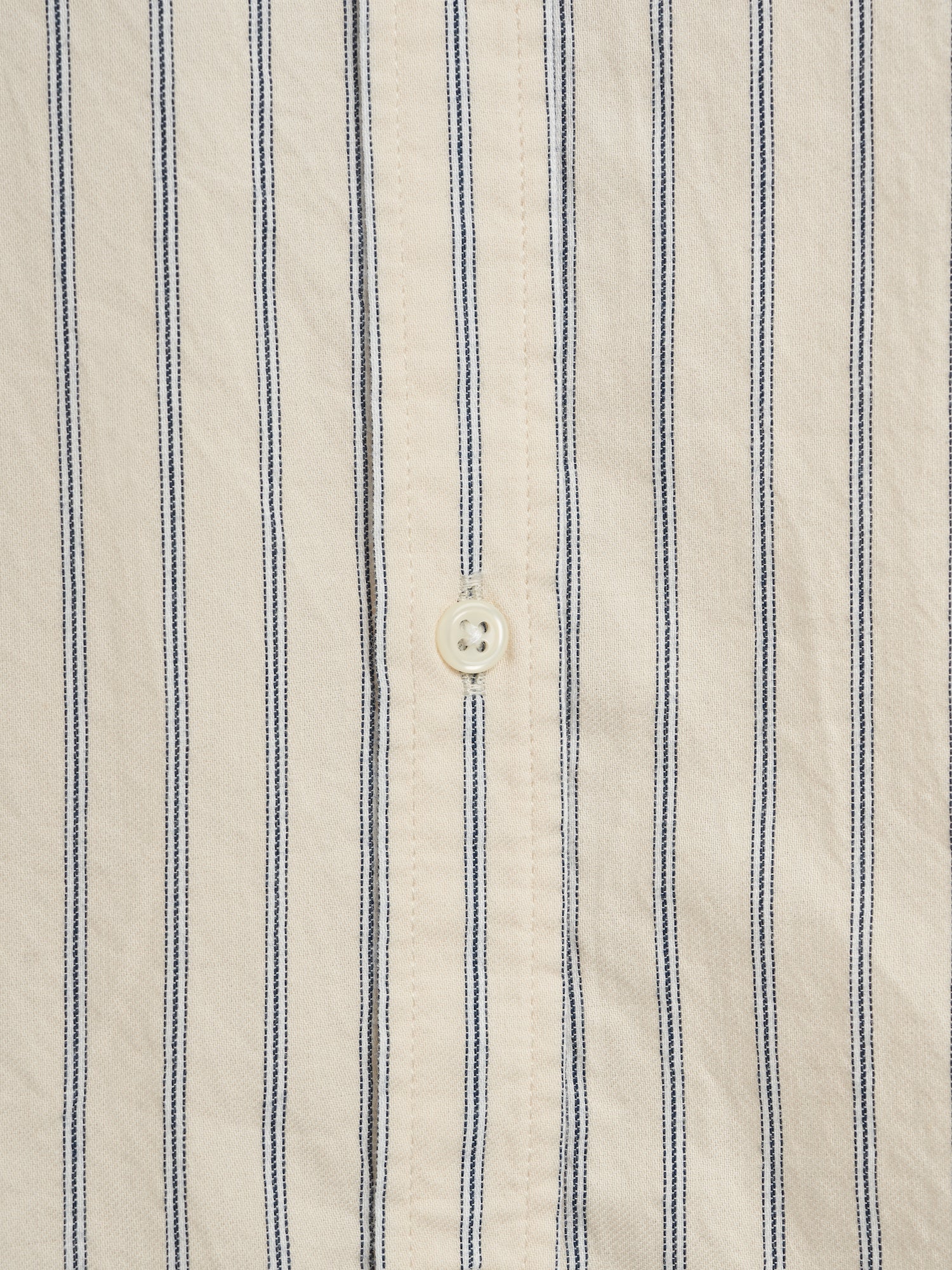 Close up button shot of Oliver Spencer Men's Cream Stripe Organic Cotton Shirt