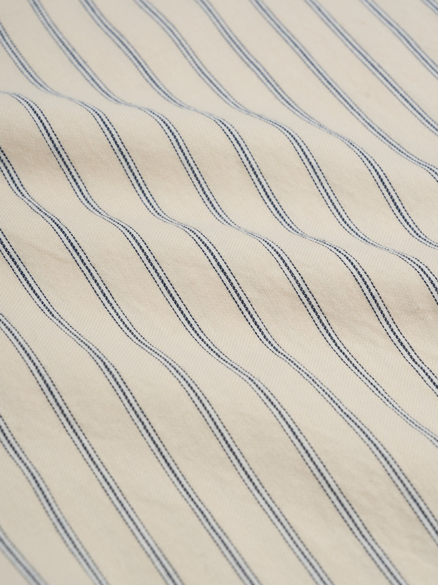 Detailed material shot of Oliver Spencer Men&#39;s Cream Stripe Organic Cotton Shirt