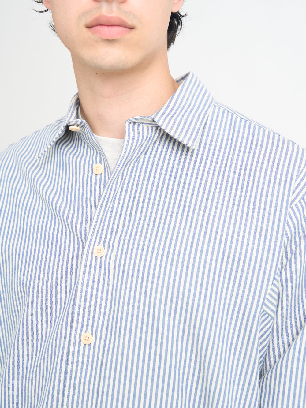 Close up collar shot of model wearing Oliver Spencer Oversized Spread Collar Organic Cotton Shirt