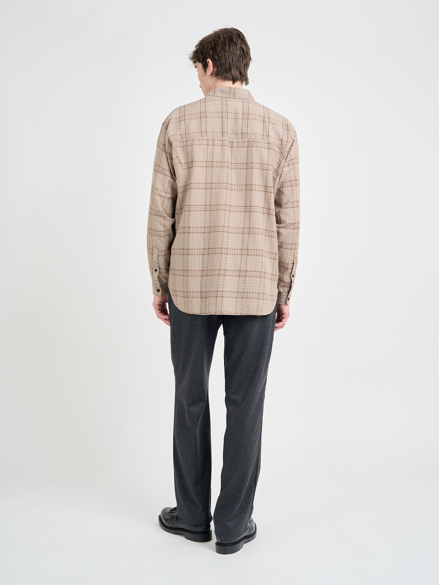 Back shot of Model wearing a Loose Fitting Oliver Spencer Garrison Long Sleeve Shirt in Connell Beige.