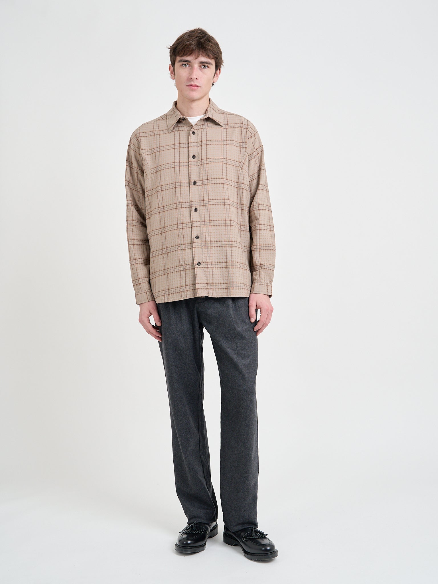 Model wearing a Loose Fitting Oliver Spencer Garrison Long Sleeve Shirt in Connell Beige.