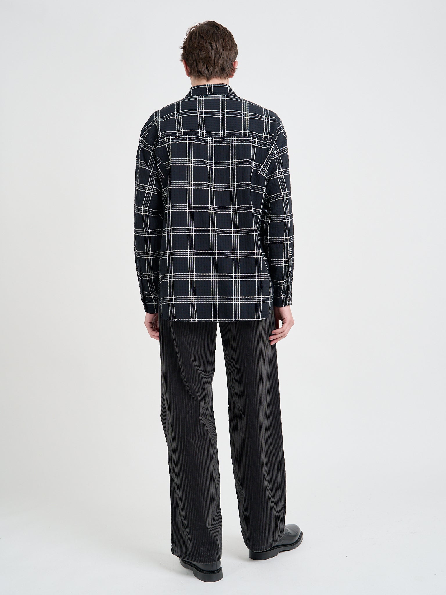 Back shot of Model wearing Oliver Spencer Men's Black Organic Cotton Check Overshirt