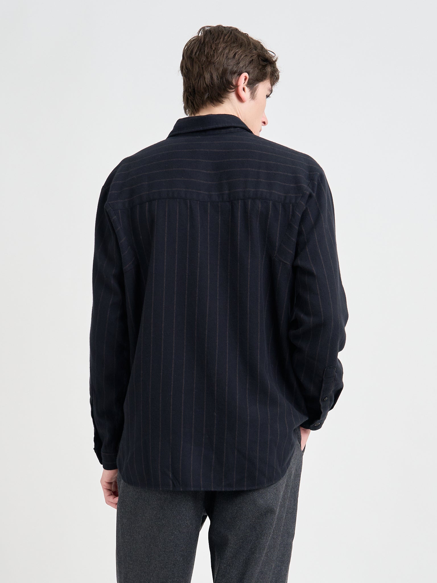 Back Shot of Model wearing an Oliver Spencer Loose Fitting Garrison Long Sleeve Shirt in Nielson Navy