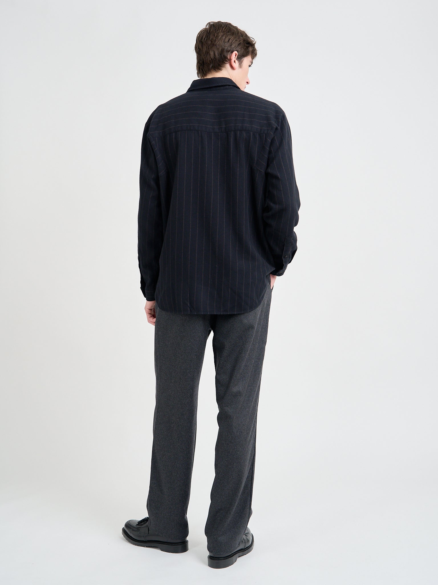 Model is wearing an Oliver Spencer Men's Navy Loose-Fit Organic Cotton Overshirt