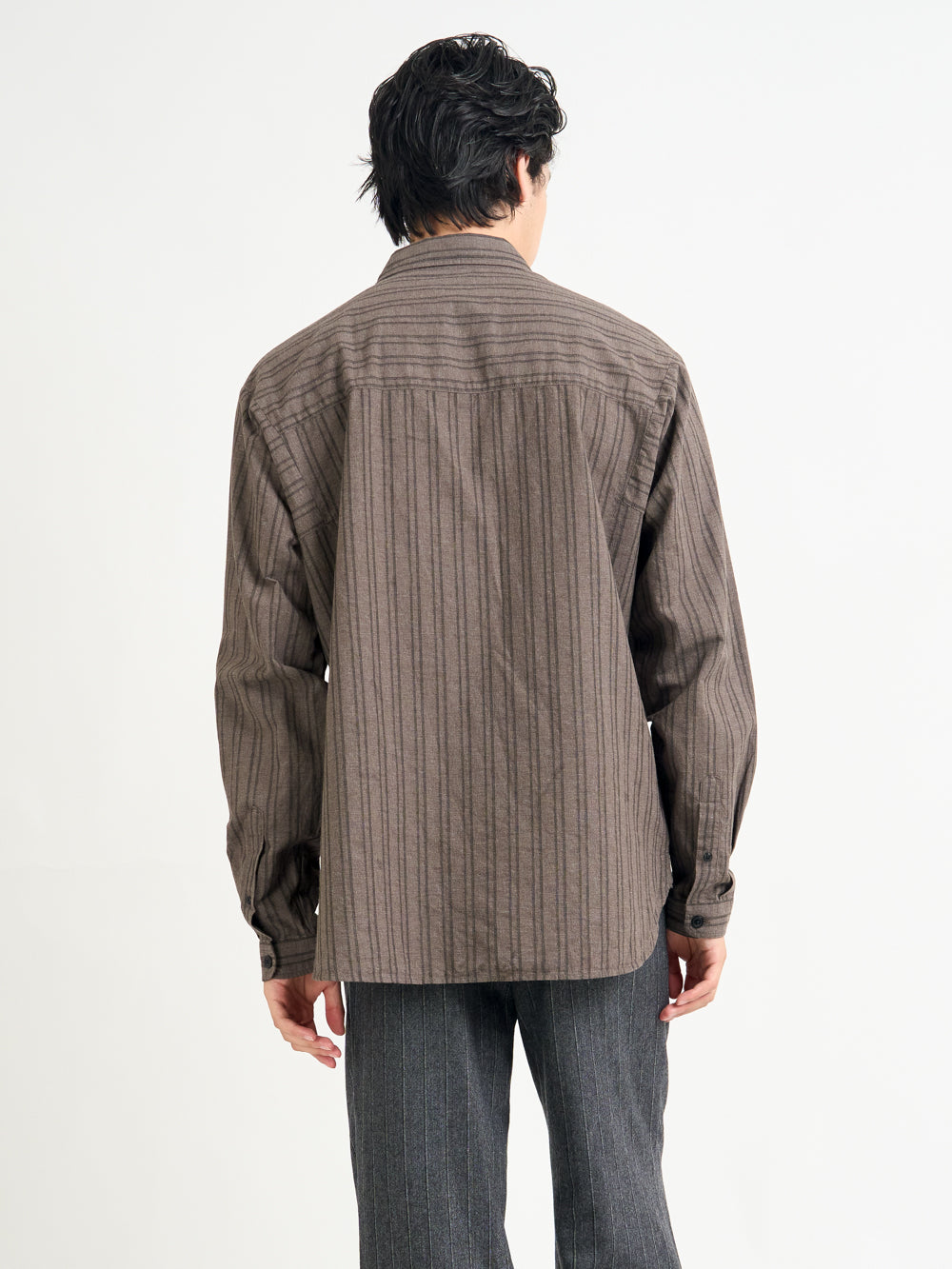 Close up back shot of model wearing Oliver Spencer Men&#39;s Brown Striped Oversized Spread Collar Cotton Shirt