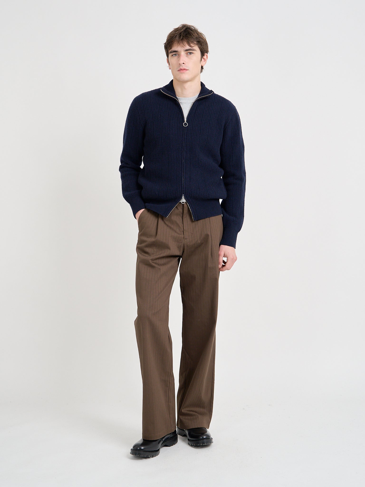 Model wearing Oliver Spencer Men's Navy Zip up Wool Cardigan