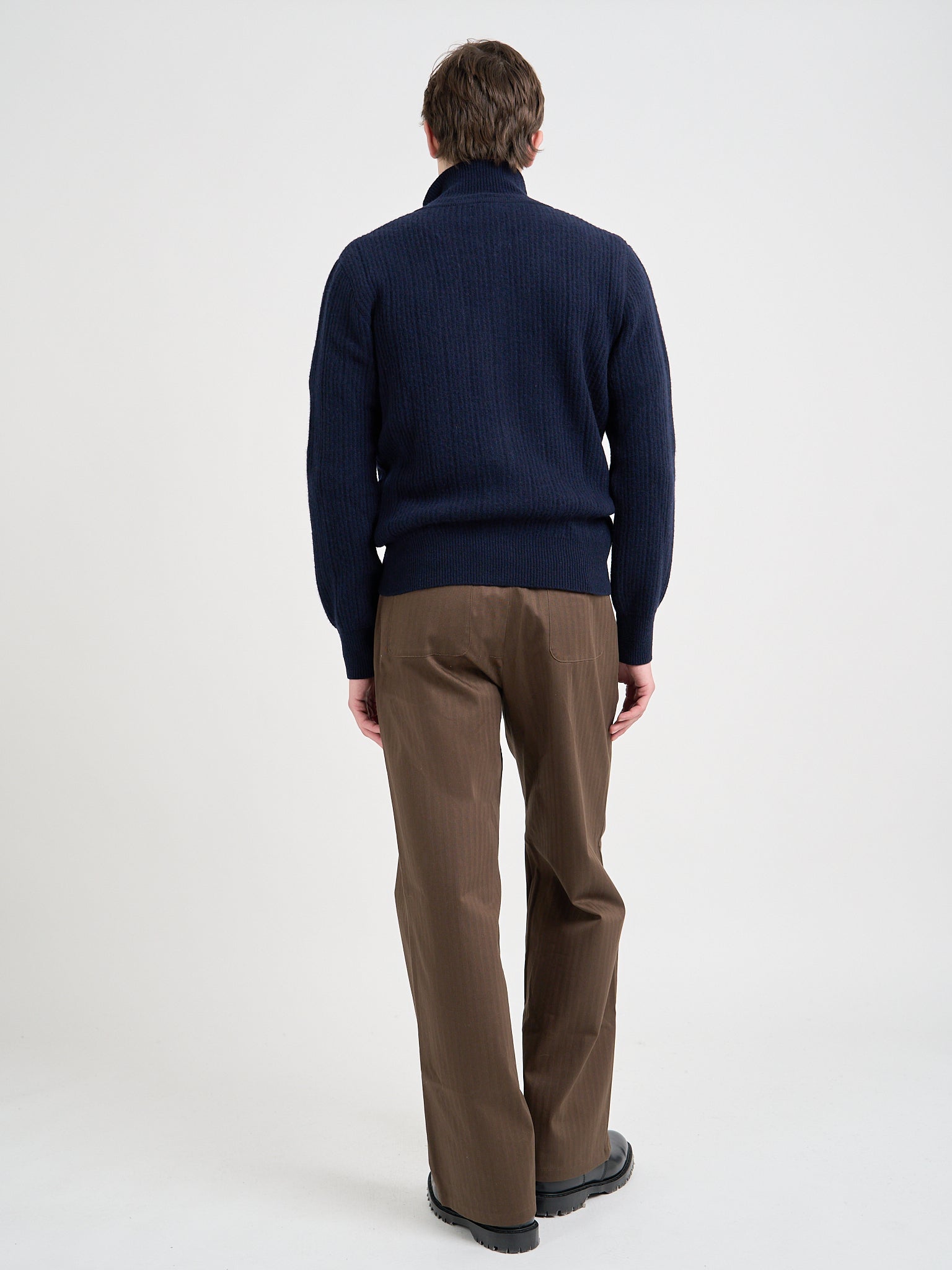 Back shot of model wearing Oliver Spencer Men's Navy Zip up Wool Cardigan