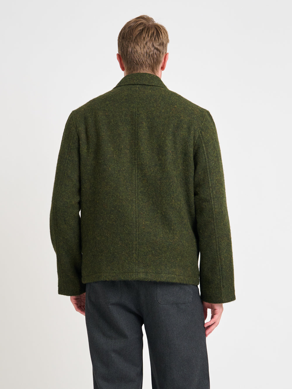 Close up back shot of model wearing Oliver Spencer Men&#39;s Green Midweight Wool Field Jacket