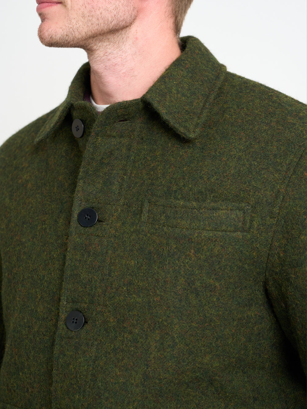 Detailed collar shot of model wearing Oliver Spencer Men&#39;s Green Midweight Wool Field Jacket 