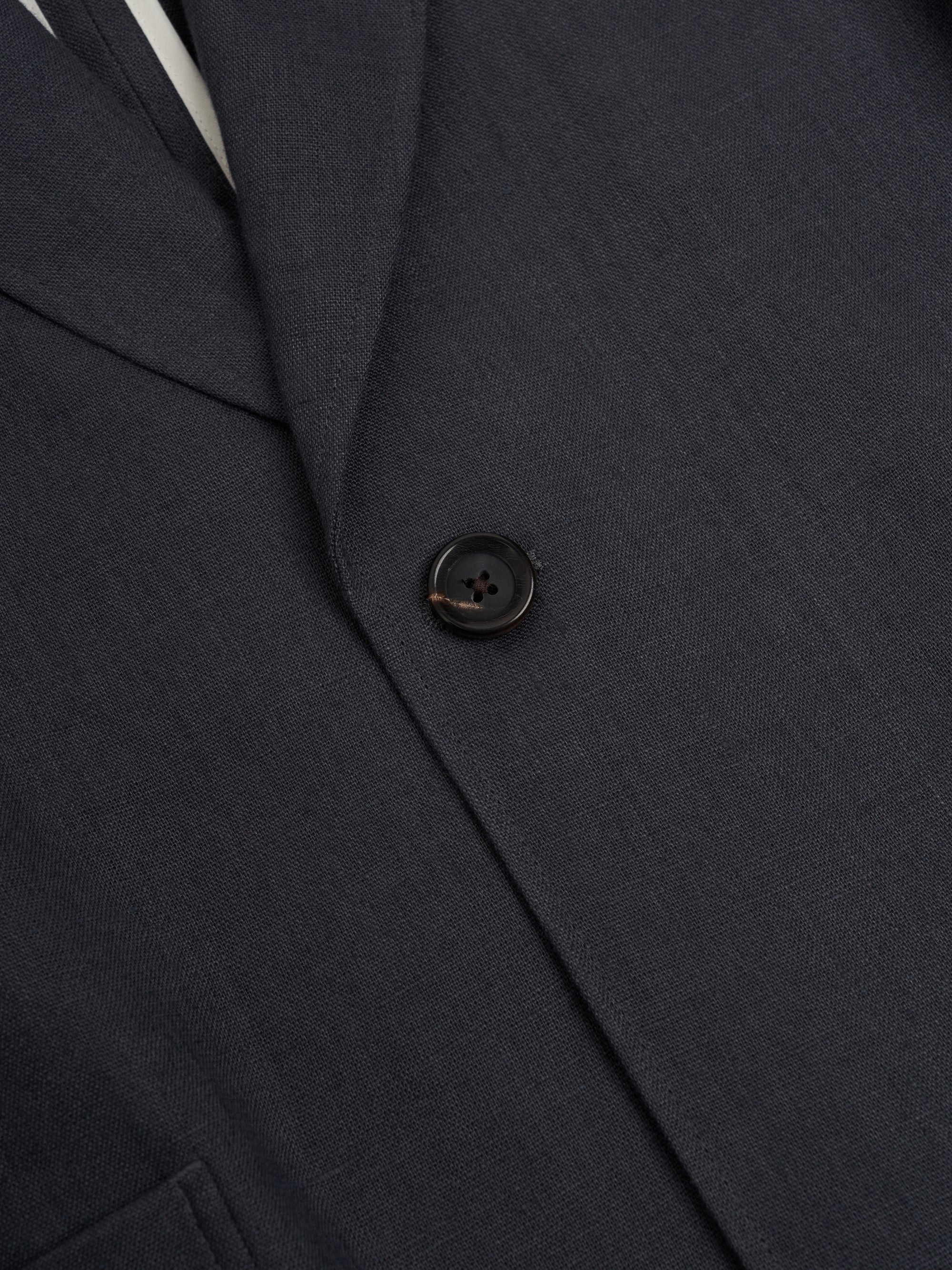 Detailed button shot of Oliver Spencer Men's Single Breasted Peak Lapel Linen Jacket