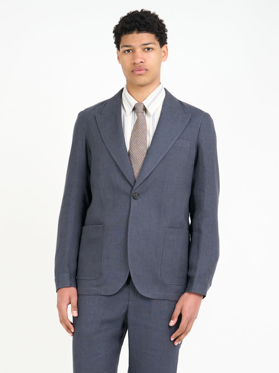 Detailed shot of model wearing Oliver Spencer Men's Single Breasted Peak Lapel Linen Jacket