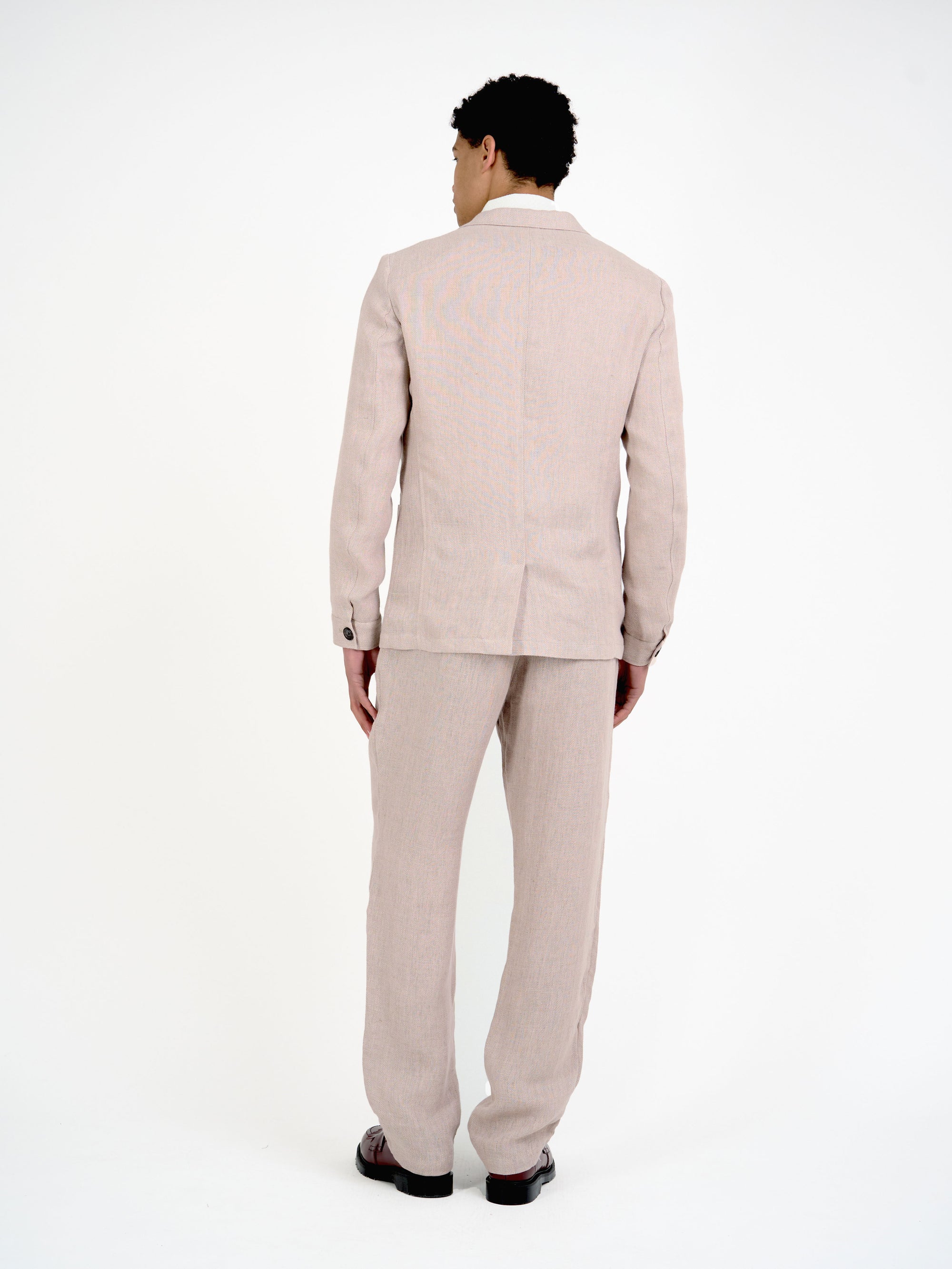 Back shot of model wearing Oliver Spencer Men's Single Breasted Peak Lapel Pink Linen Jacket
