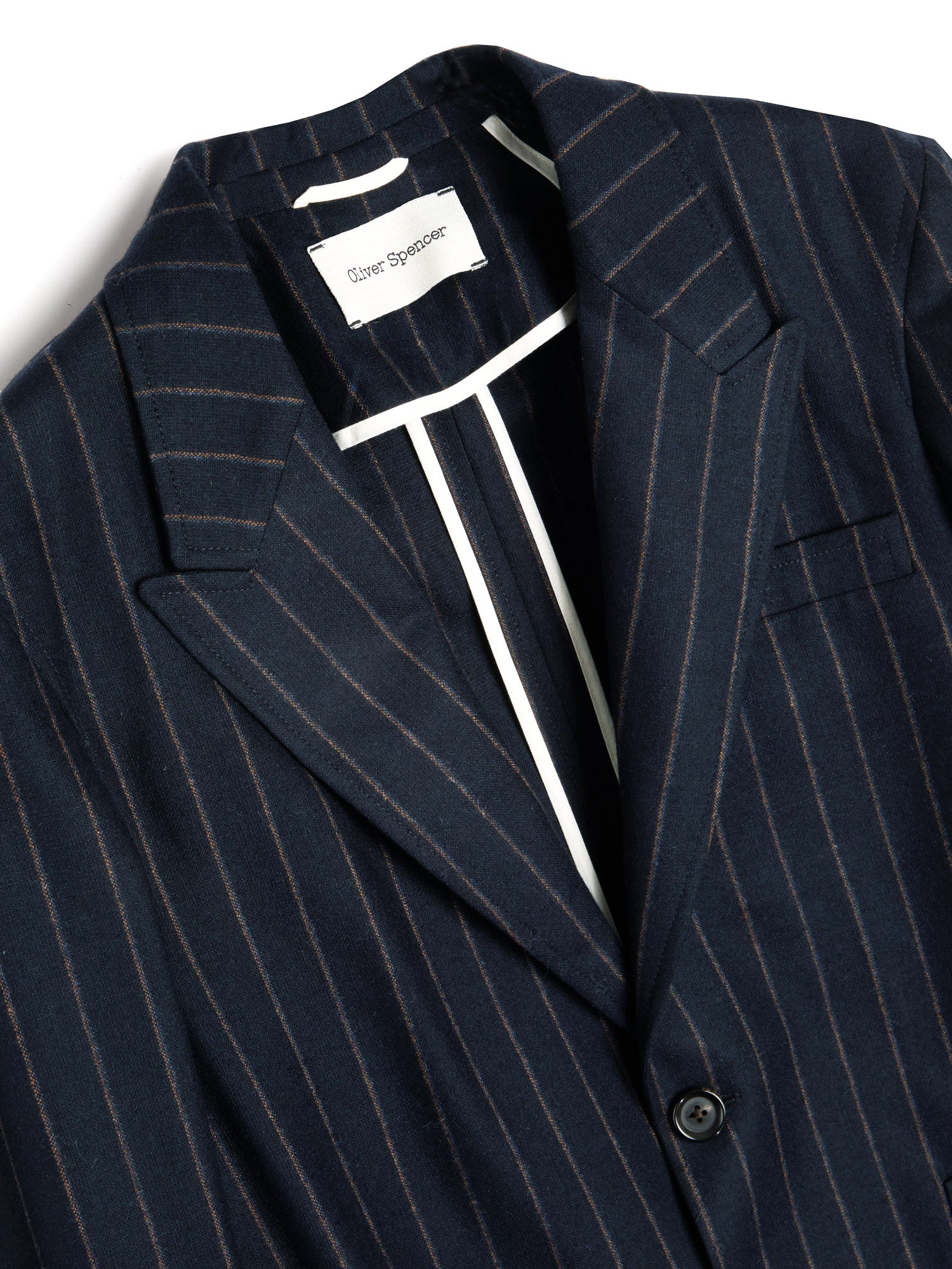 Close up collar shot of Oliver Spencer Men's Unstructured Peak Lapel Navy Striped Jacket