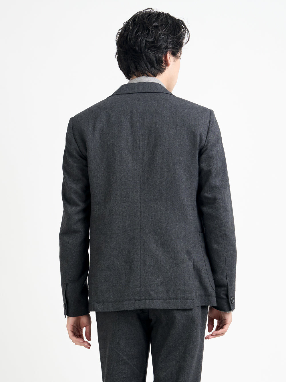Close up back shot of model wearing Oliver Spencer Men's Unstructured Peak Lapel Grey Jacket