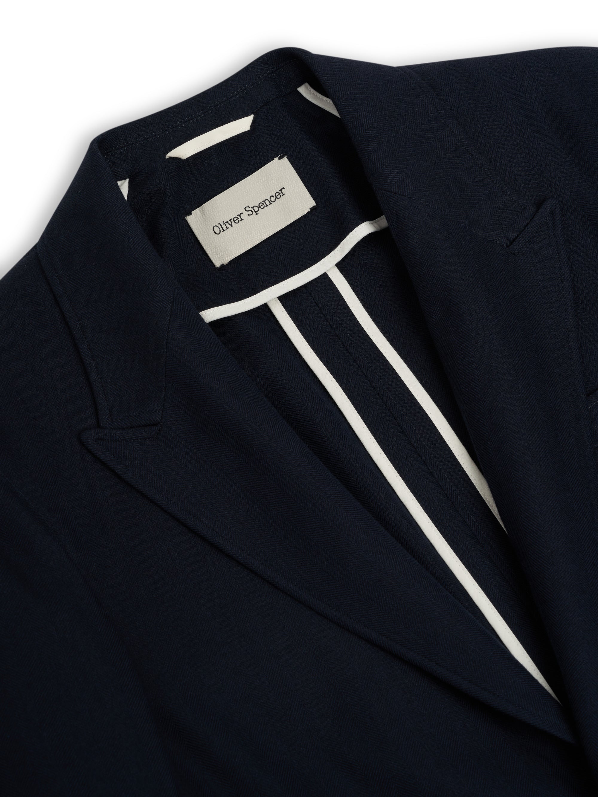 Detailed collar shot of Oliver Spencer Men's Unstructured Peak Lapel Navy Cotton Jacket