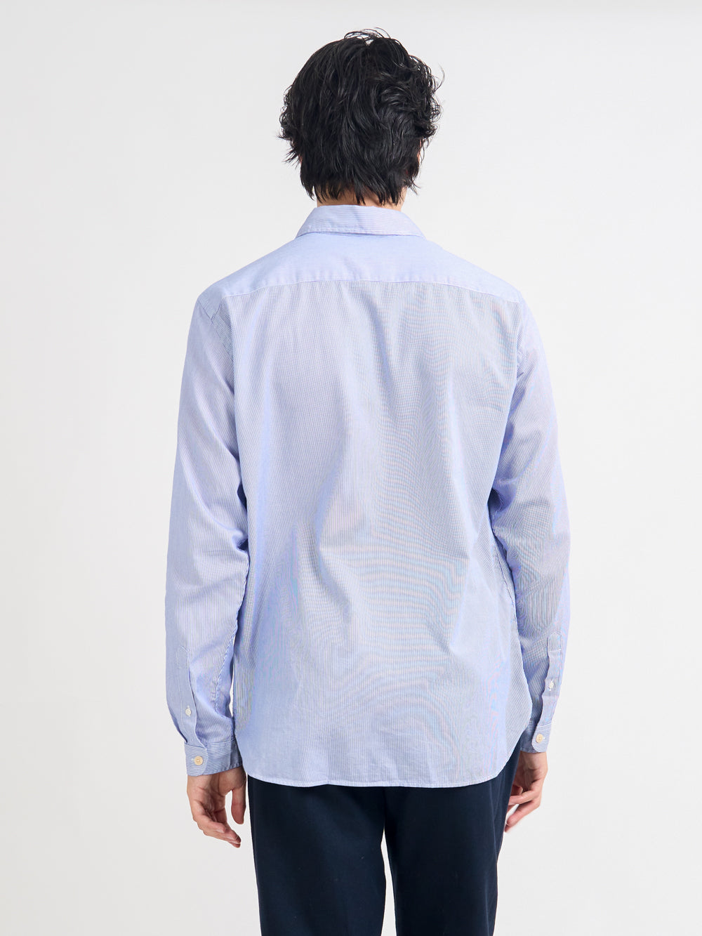 Close up back shot of model wearing Oliver Spencer Striped Light Blue and White Spear Collar Organic Cotton Shirt