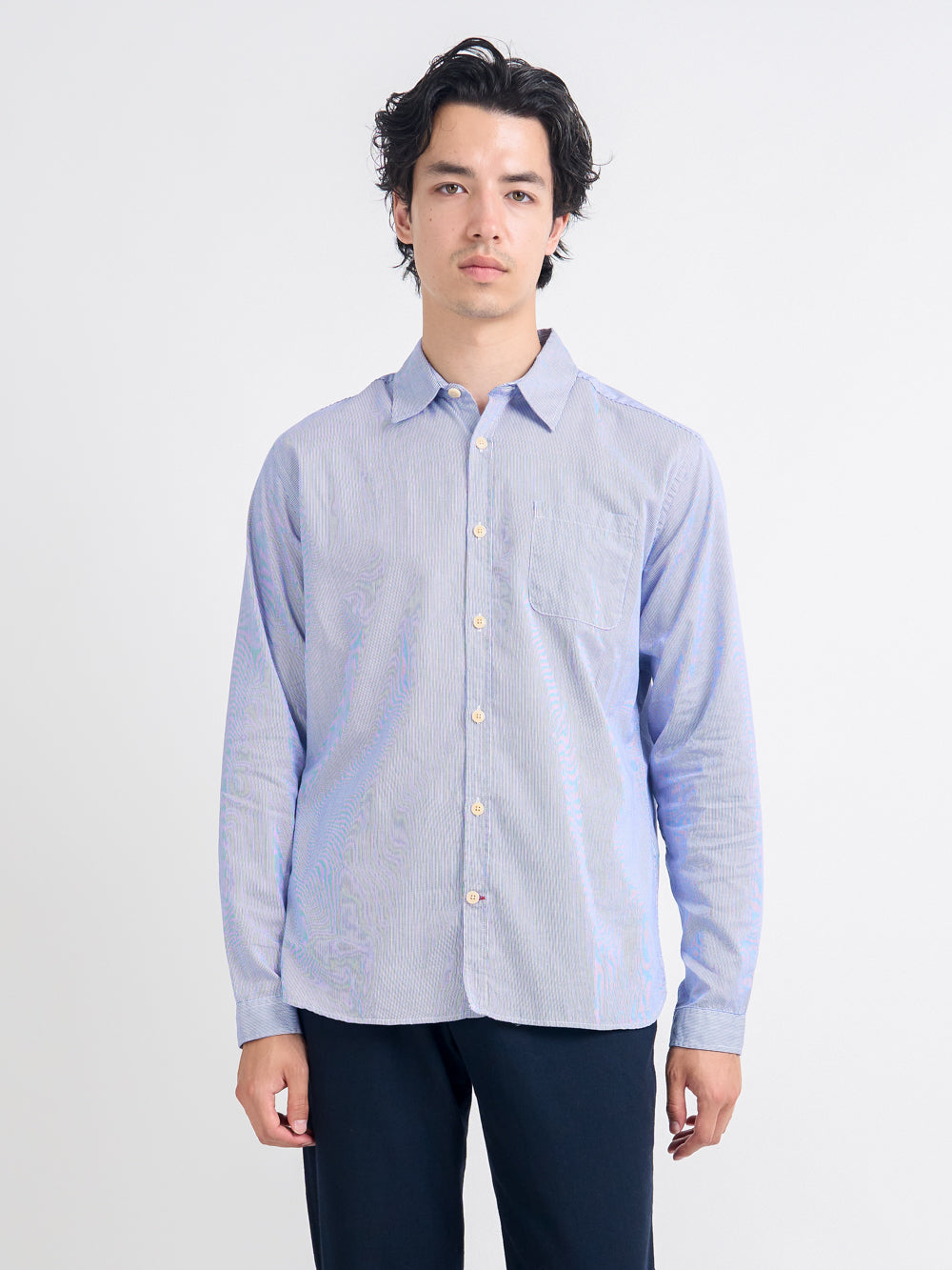 Close up shot of model wearing Oliver Spencer Striped Light Blue and White Spear Collar Organic Cotton Shirt