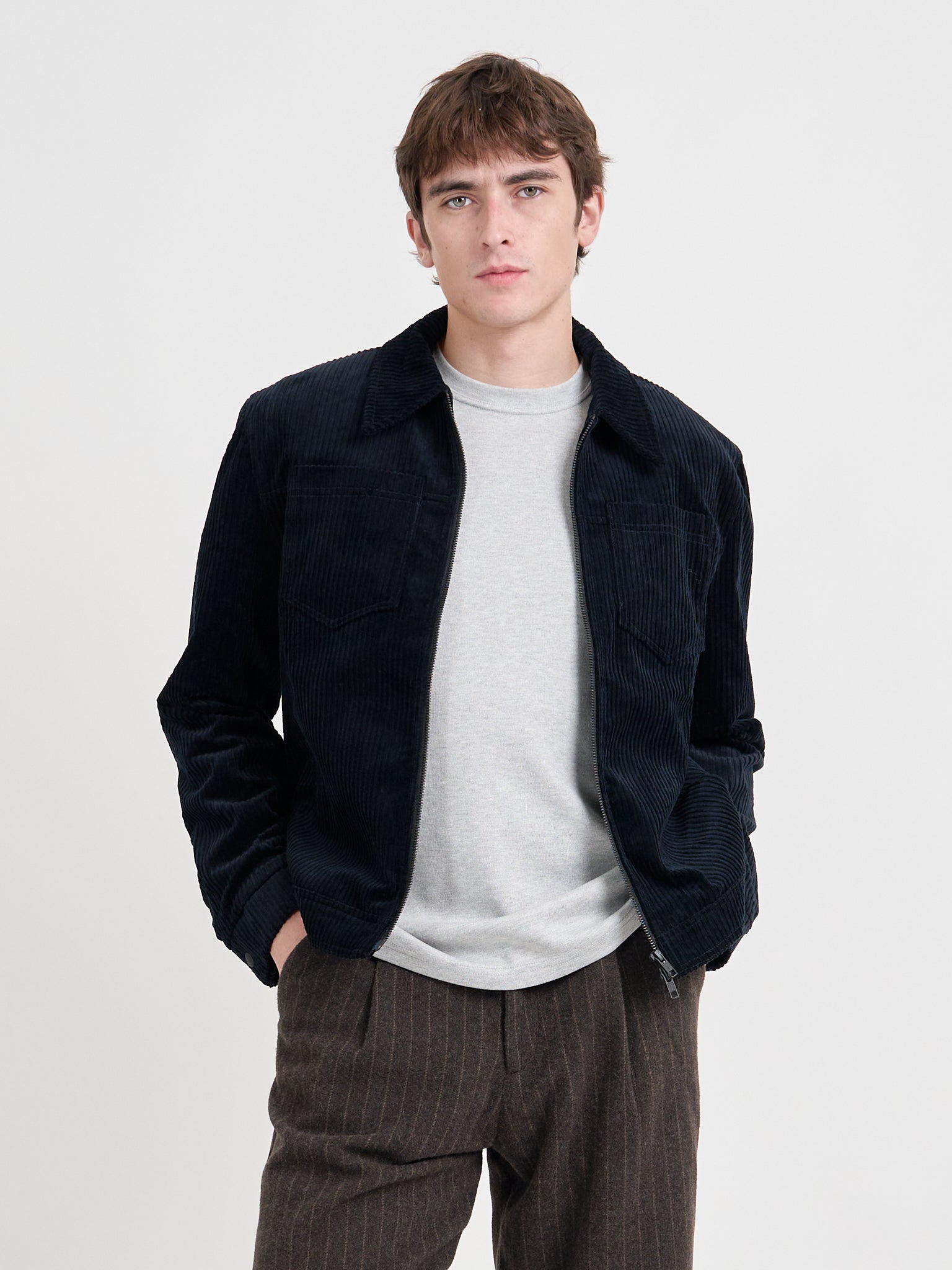 Close up shot of model wearing Oliver Spencer Men's Midnight Navy Cotton Corduroy Trucker Jacket Flat Shot