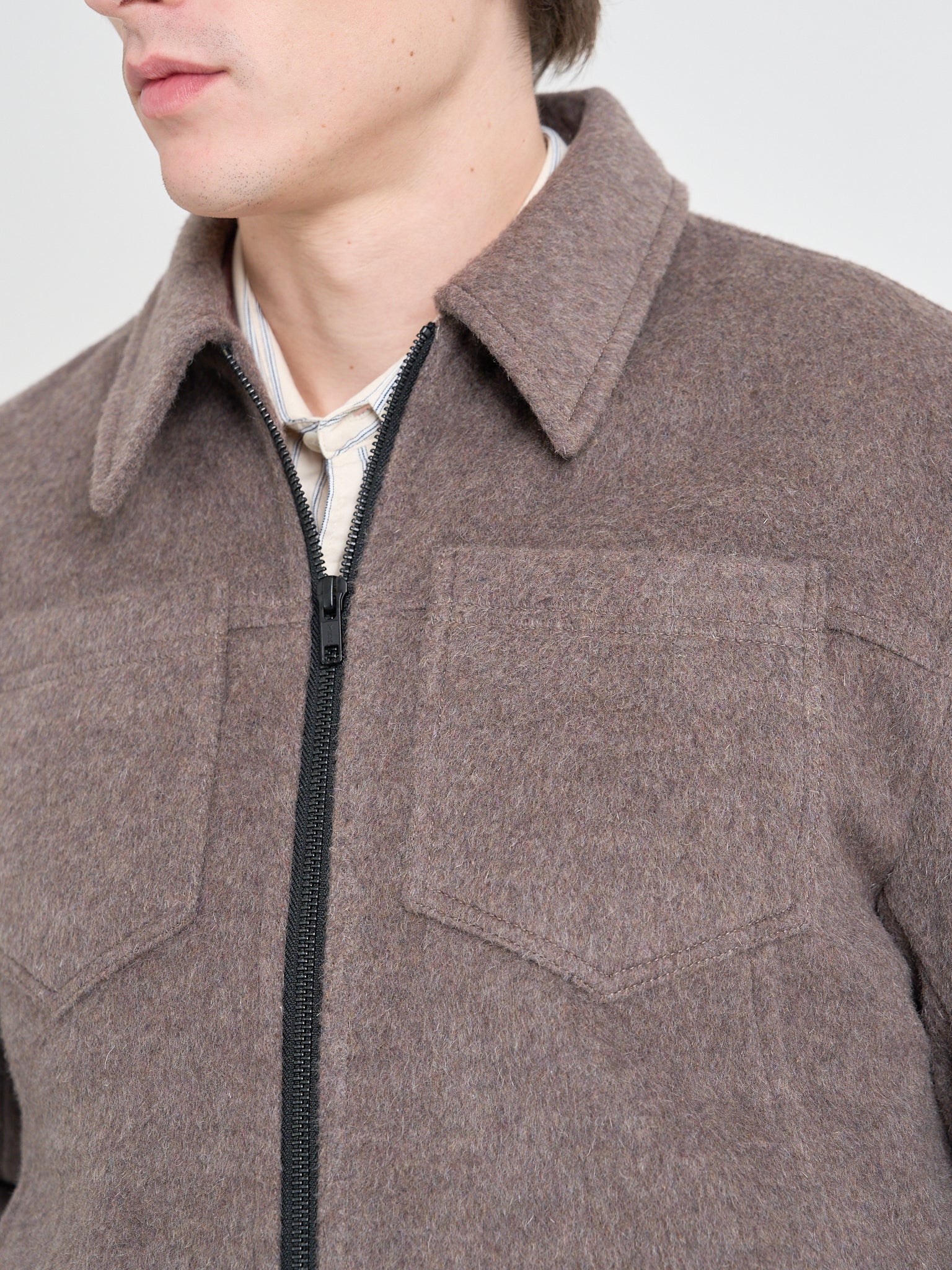 Detailed collar shot of model wearing Oliver Spencer Men's Taupe Recycled Wool And Mohair Trucker Jacket