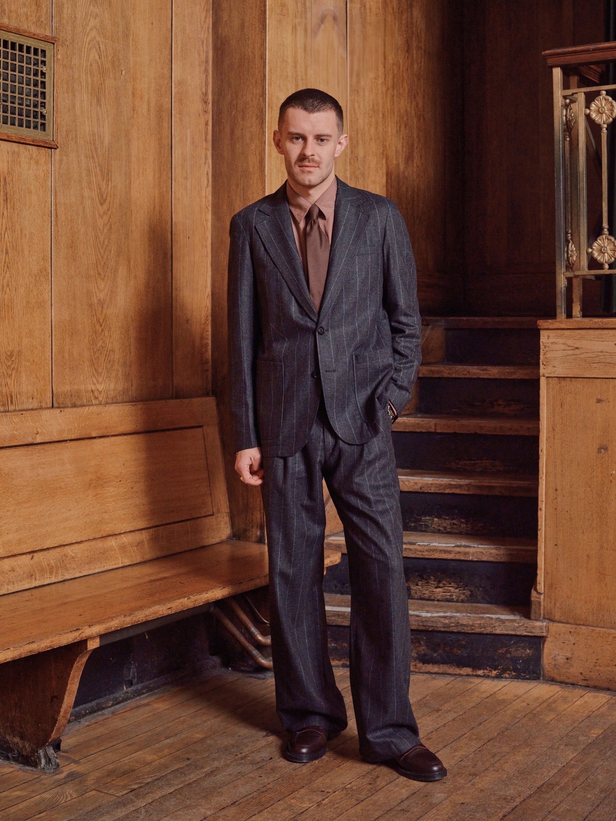 Model in a pinstripe suit, full length