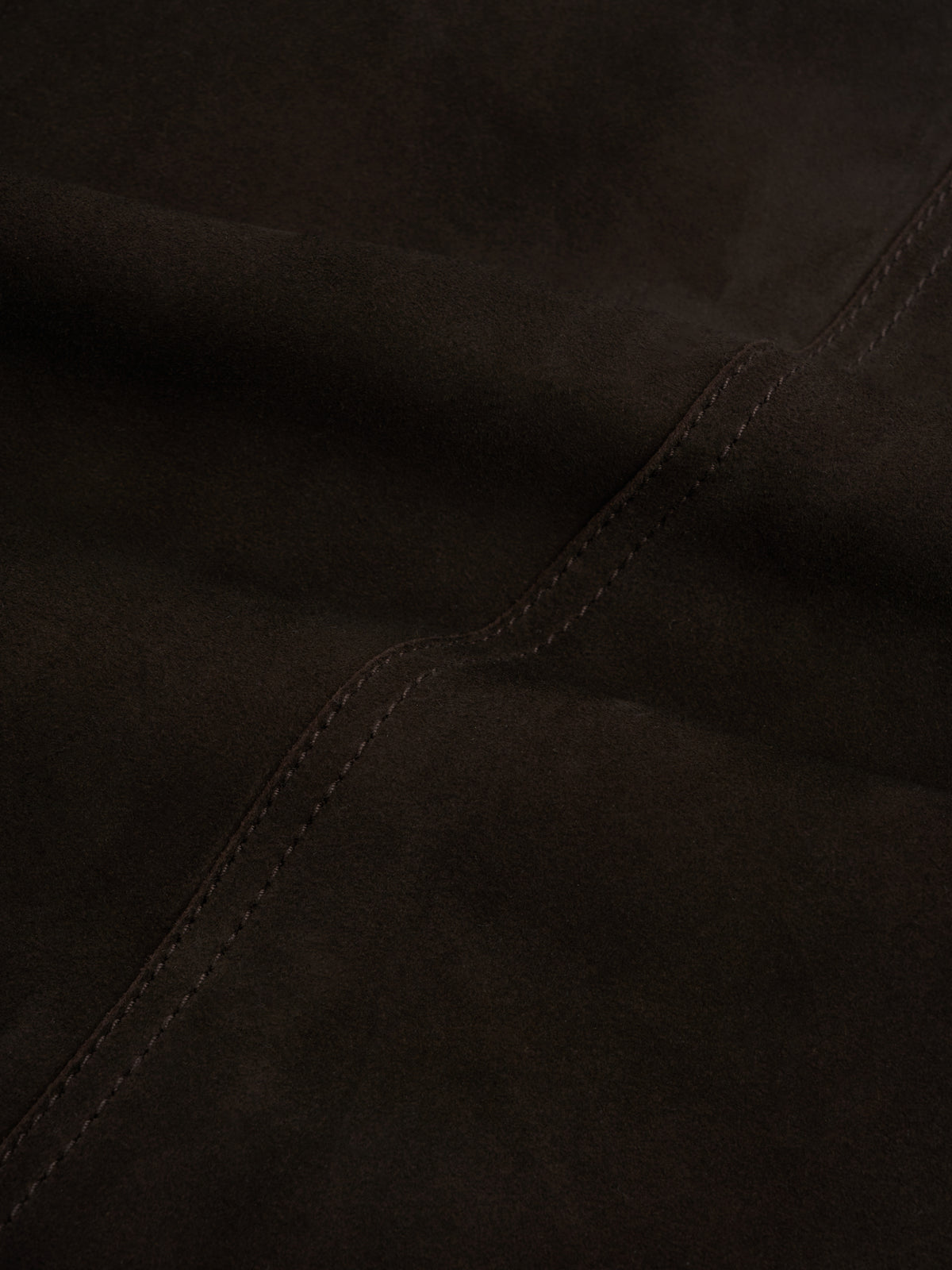 Shawcross Jacket Suede Chocolate Brown, Close view of napped brown surface with a double-stitched seam