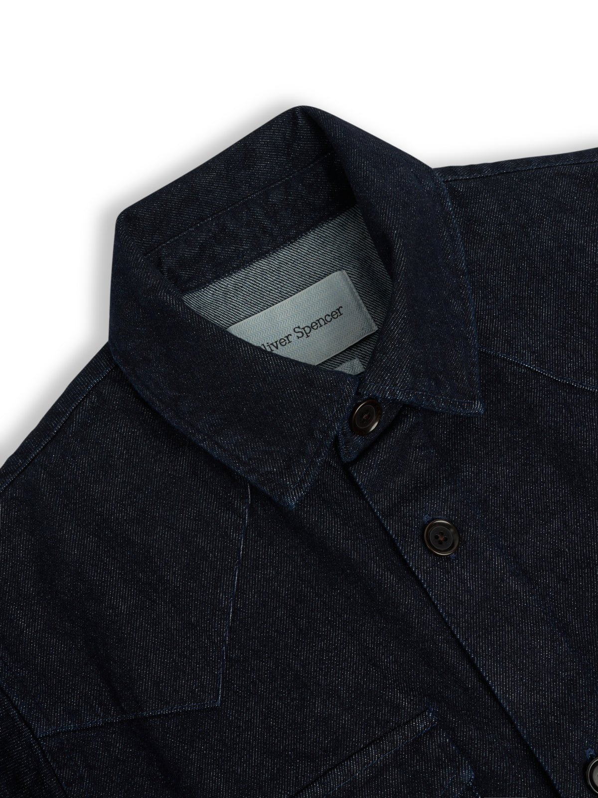 Collar. A collar and yoke with a dark button.