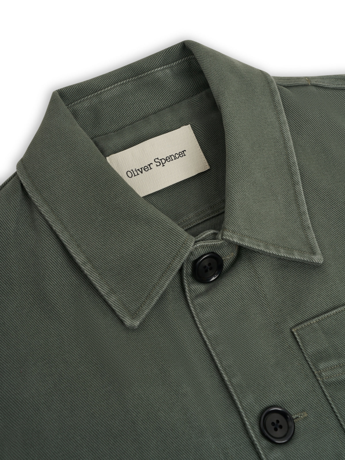 Collar. A collar with a woven label and two black buttons.