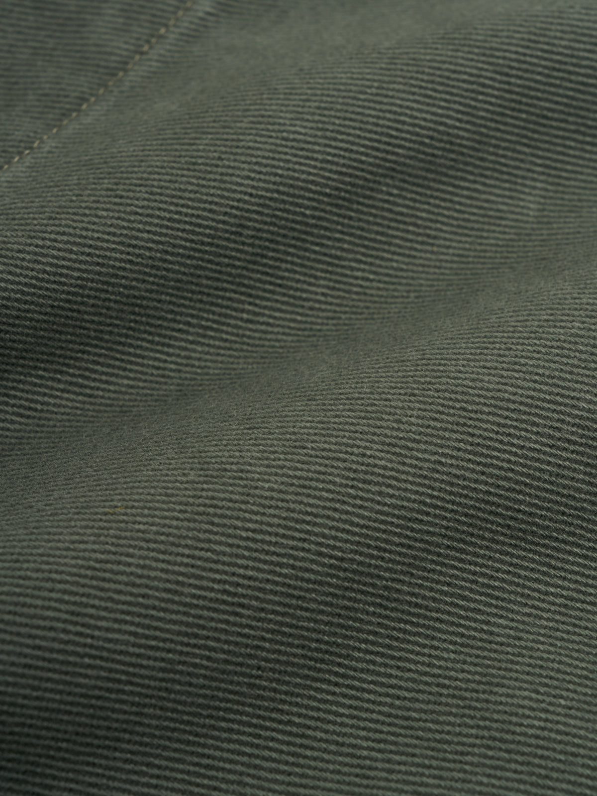 Kennard Jacket Hester Green, Close-up of fine diagonal twill weave in green