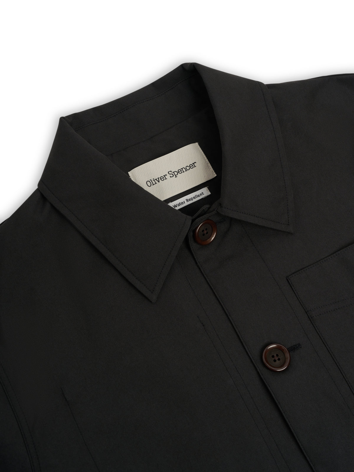 Collar. A collar with a brand label and the top buttons.