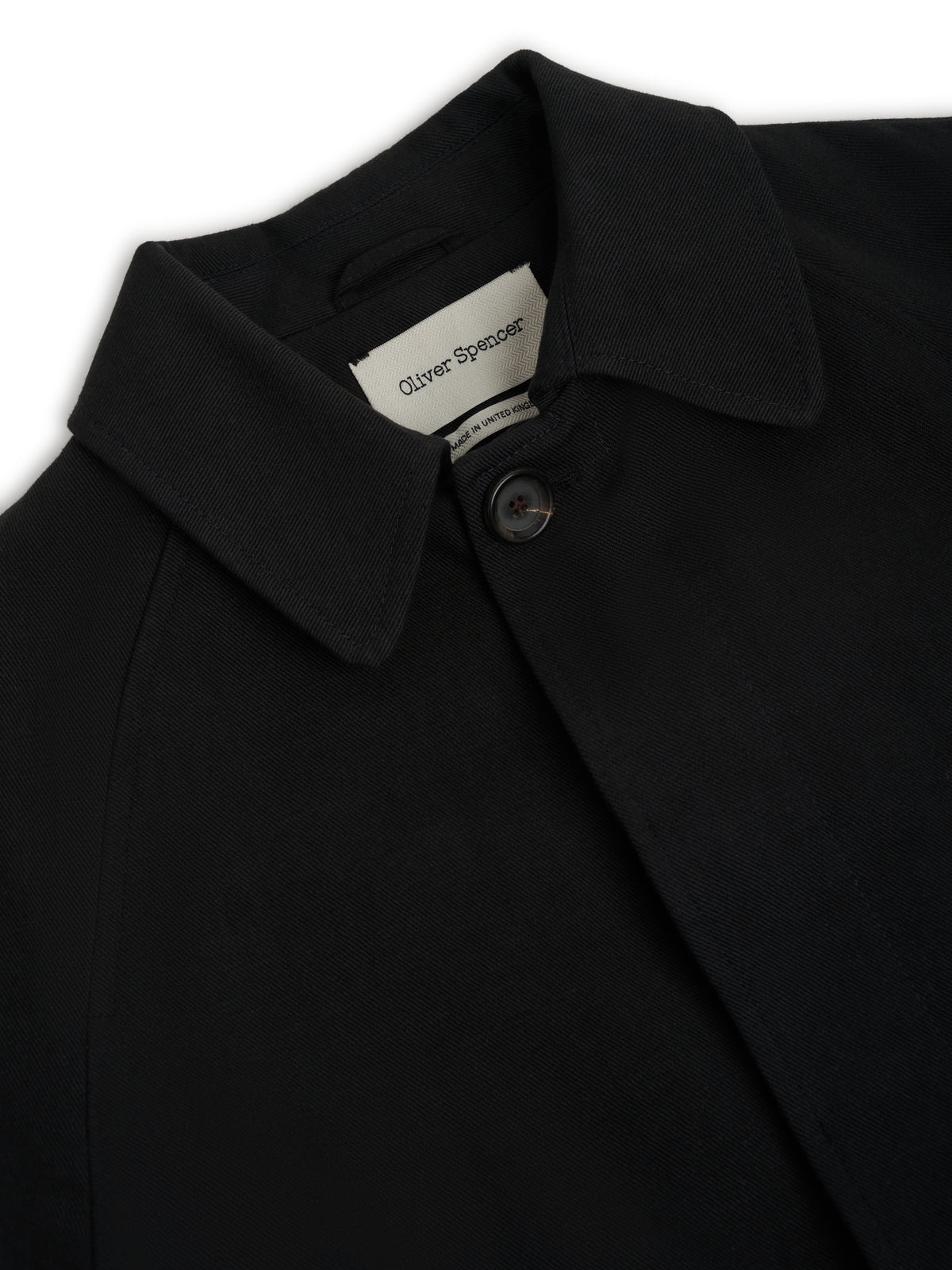 Collar. A collar with a woven label and the top button.