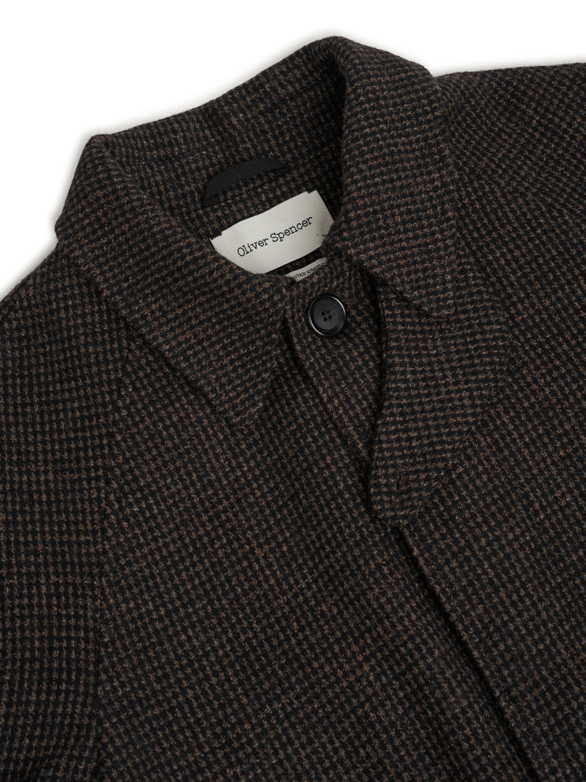 Collar. The top button shows at the neck, with a concealed placket below it.