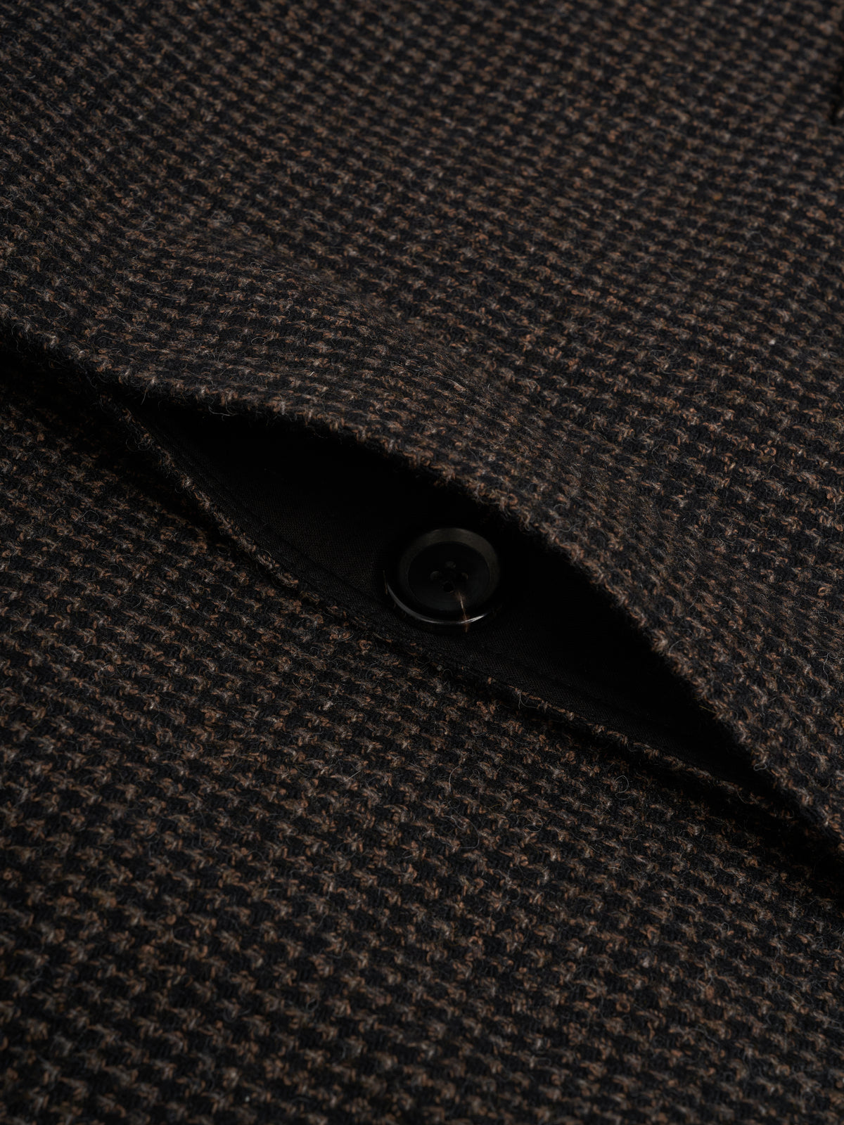 Fly front. The buttons sit behind a concealed placket.