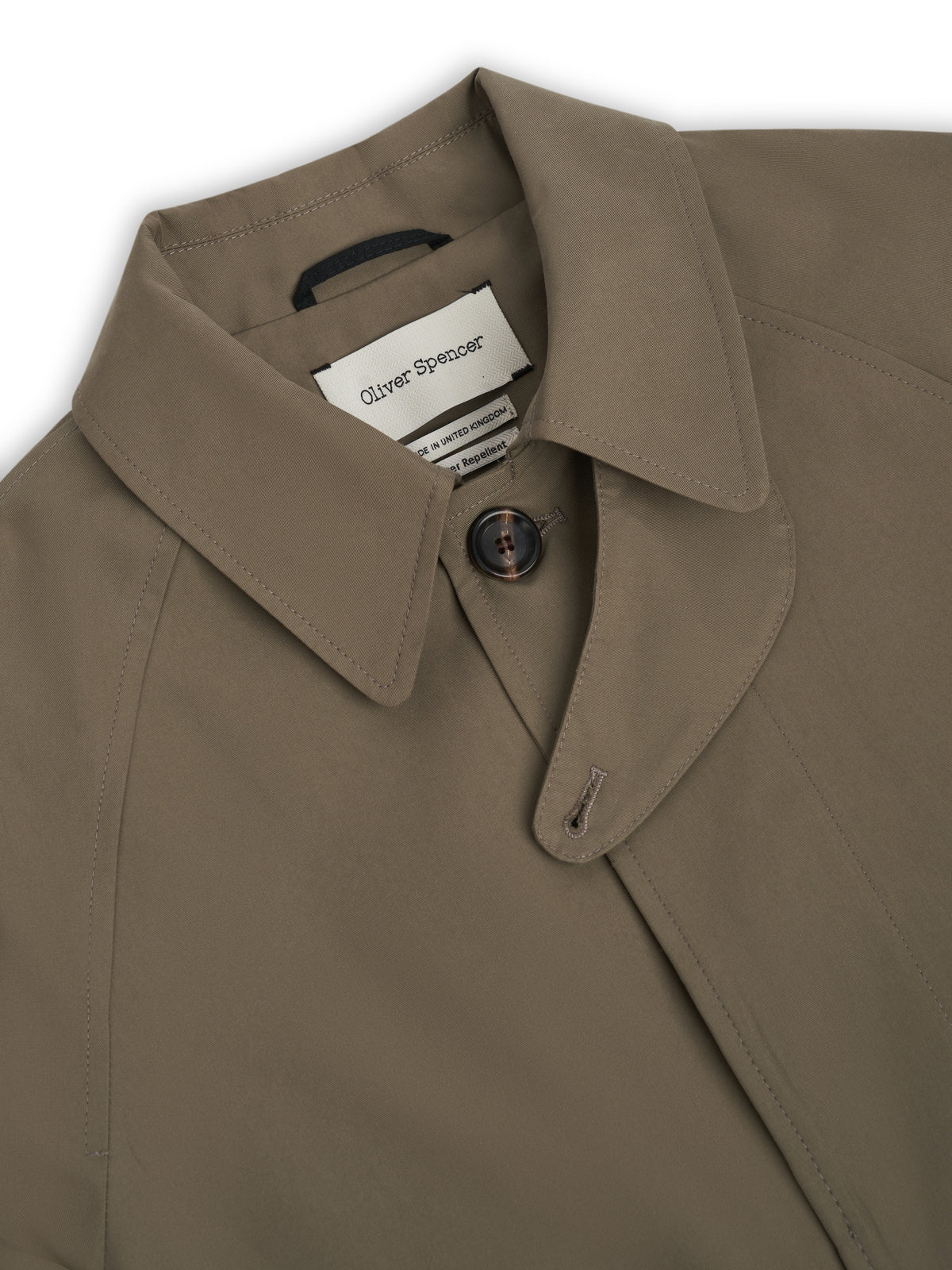 Collar. A storm guard buttons across under the collar when it is turned up.